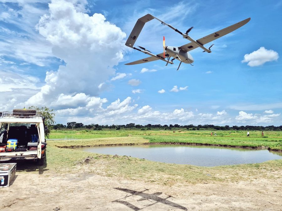 Fixed-wing aircraft banking over a farm dam