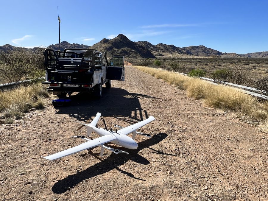 Fixed-wing aircraft beside the field vehicle on a Karoo airstrip