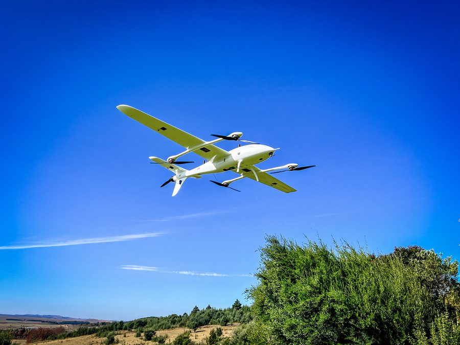 Fixed-wing aircraft in flight against a clear sky